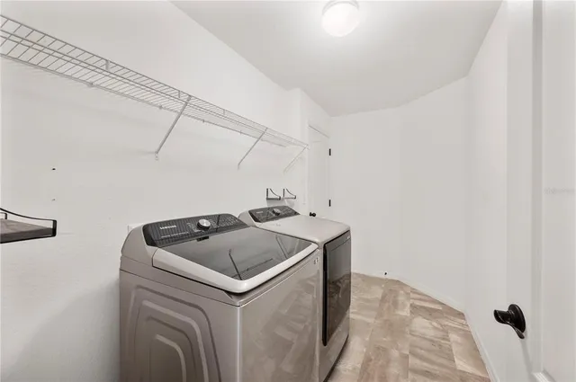 a utility room with dryer and washer