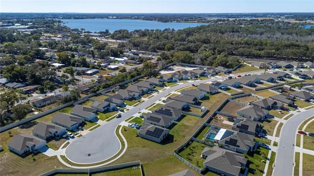 an aerial view of a swimming pool patio and mountain view