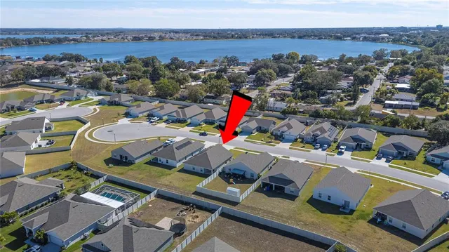 an aerial view of a house with a mountain view