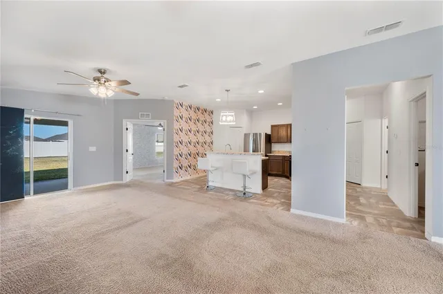 a view of a livingroom with a kitchen