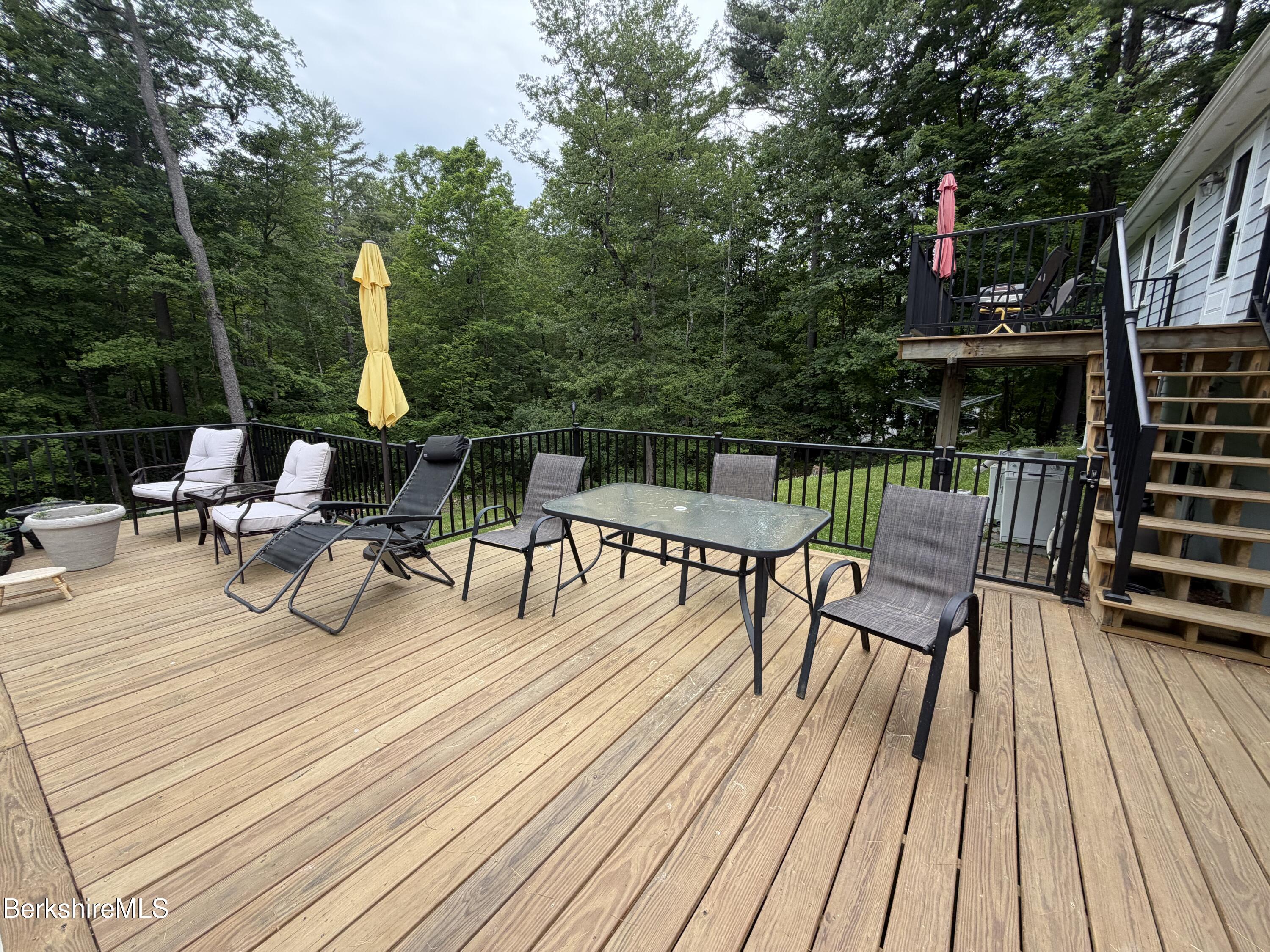 20 Sullivan Lane Lenox, MA 01240 - Photo 21 of 23 a view of house with patio outdoor seating and city view