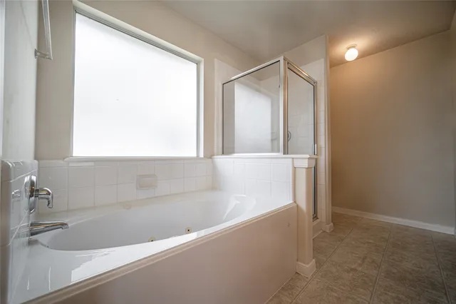 a bathroom with a bathtub and a sink