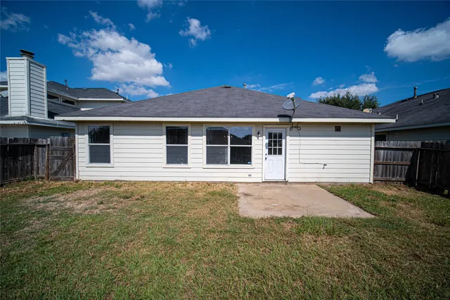 a house with yard in front of it