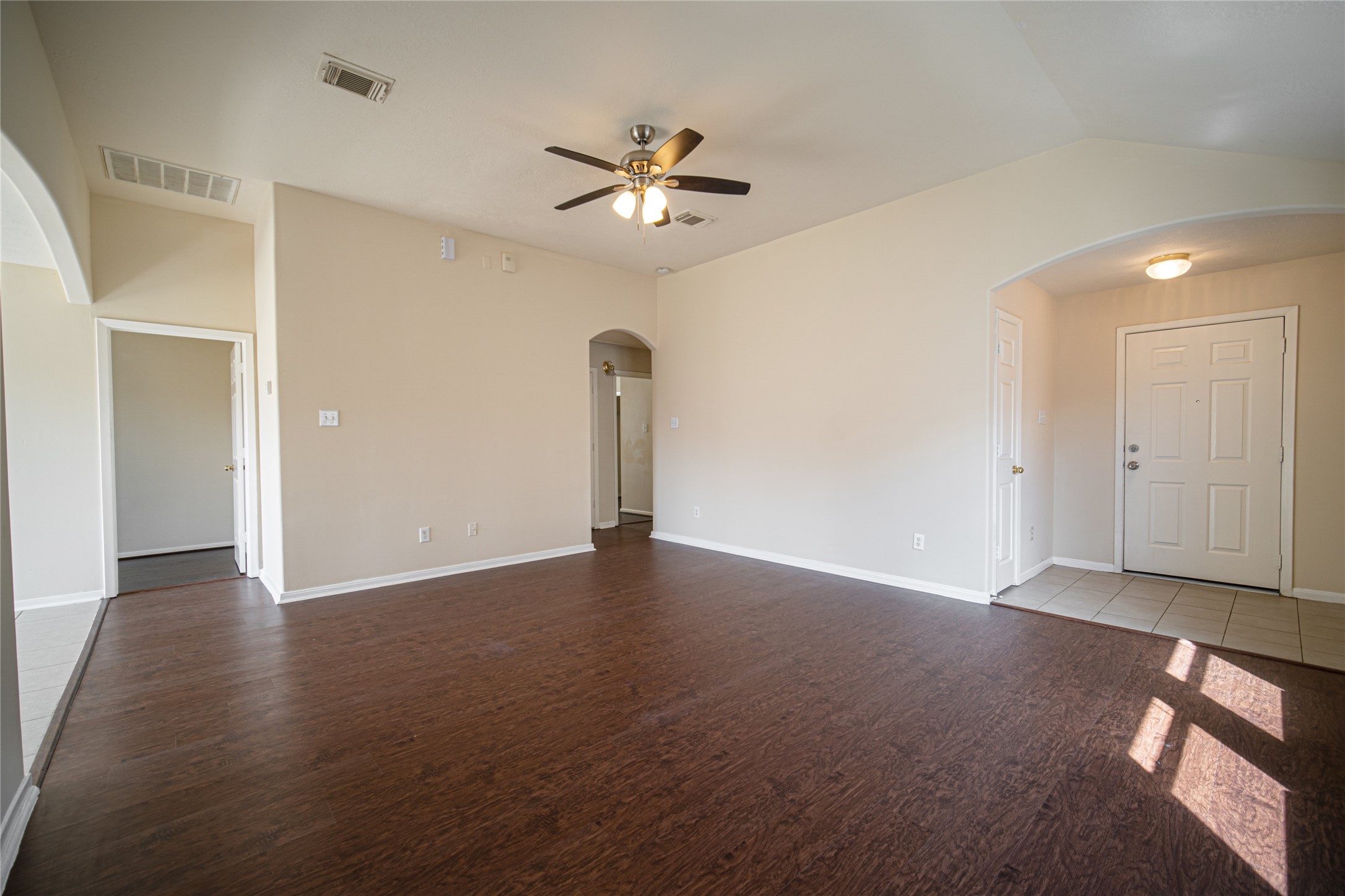19815 Portlick Court Katy, TX 77449 - Photo 4 of 16 a view of an empty room with a ceiling fan and window