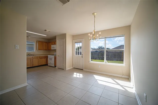 a view of a kitchen with a sink and a window
