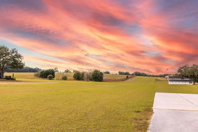 a view of a street with an ocean