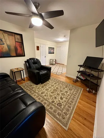 a living room with furniture and a rug