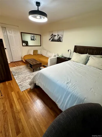 a bedroom with two beds and a chandelier