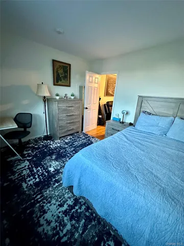 a bathroom with a sink a toilet a mirror a vanity and shower