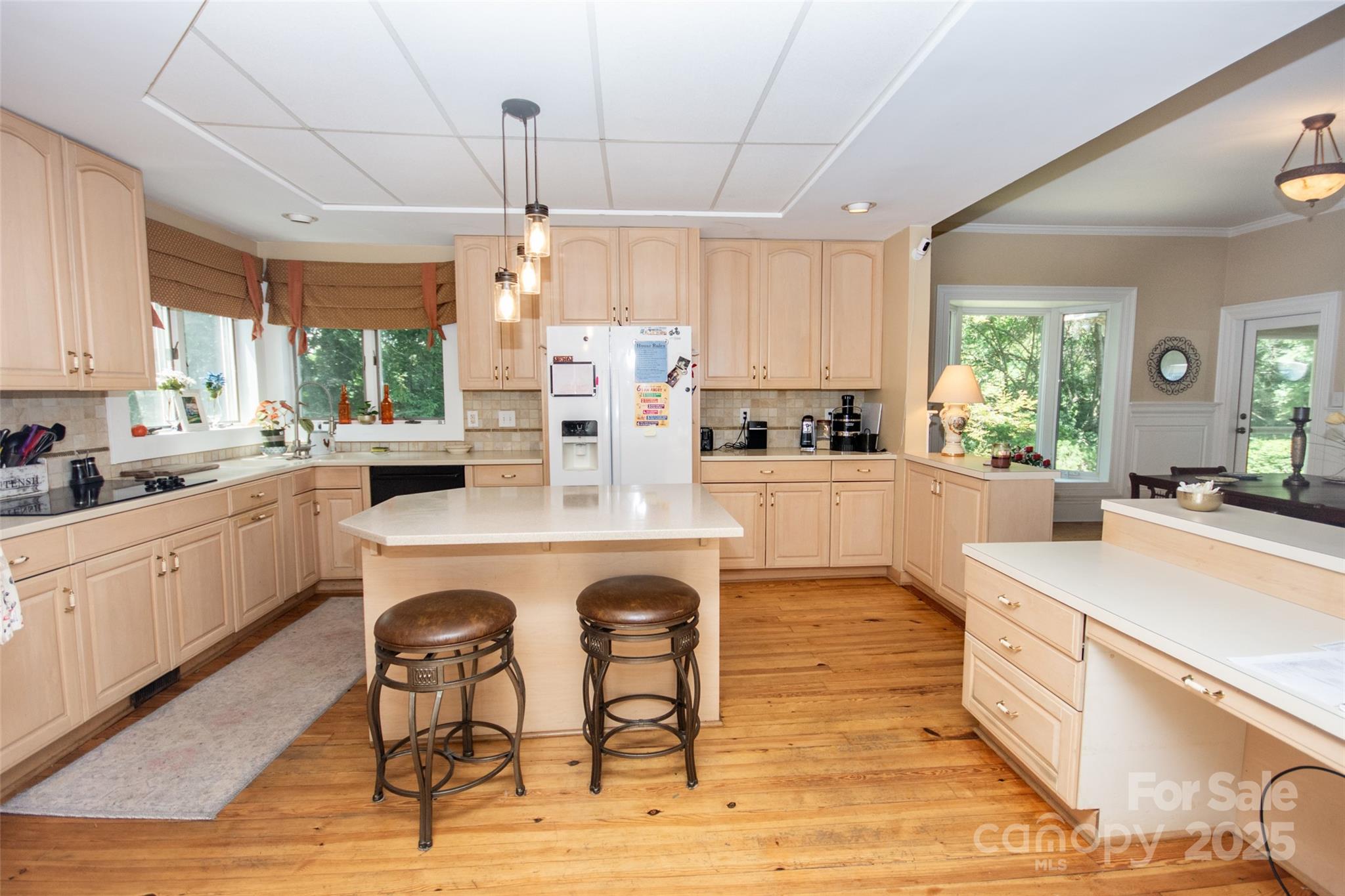 10245 Cool Springs Road Cleveland, NC 27013 - Photo 12 of 48 a kitchen with stainless steel appliances granite countertop a stove a sink dishwasher a stove and white cabinets with wooden floor
