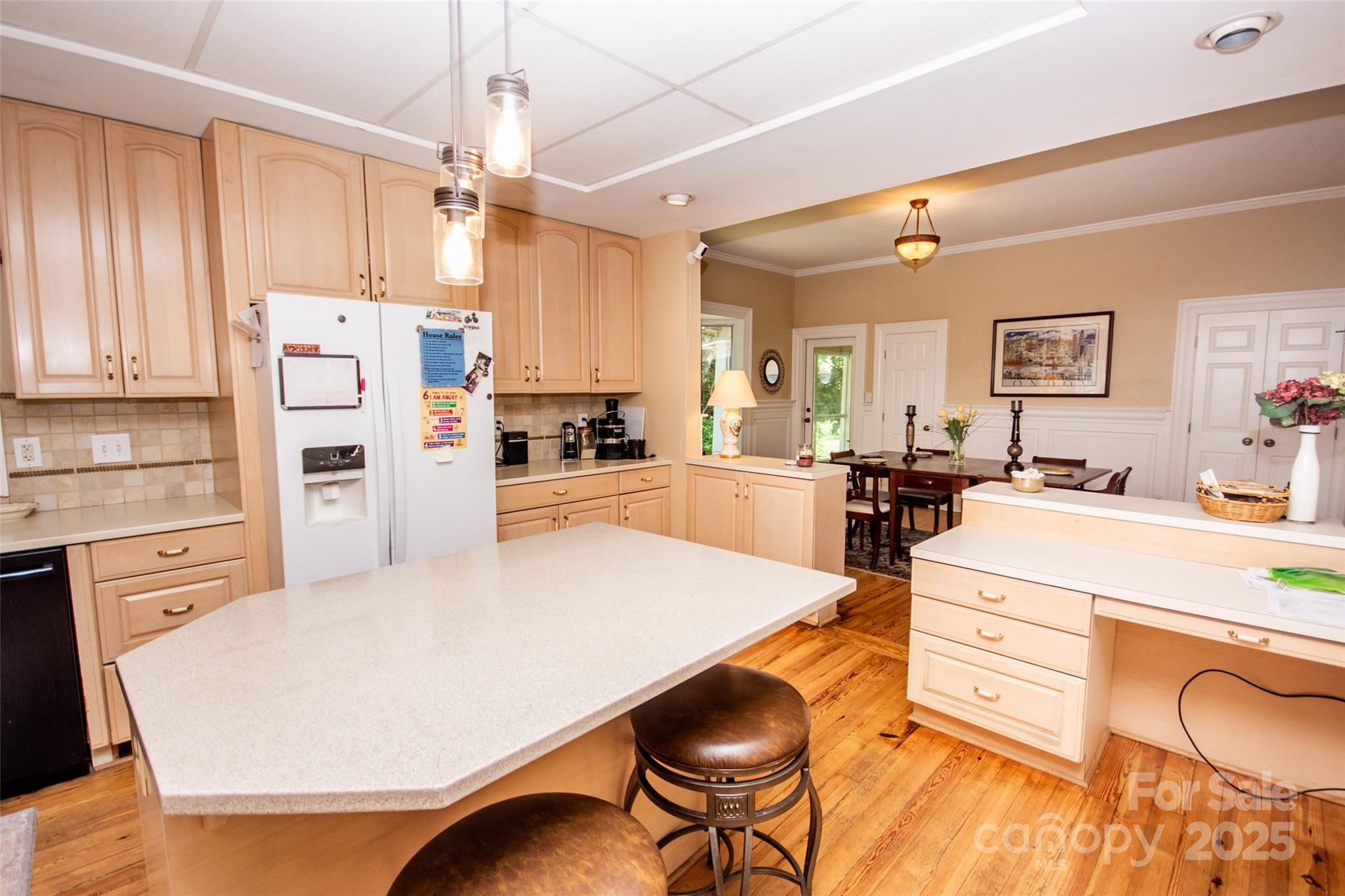 10245 Cool Springs Road Cleveland, NC 27013 - Photo 14 of 48 a large kitchen with kitchen island a stove a sink dishwasher and white cabinets with wooden floor