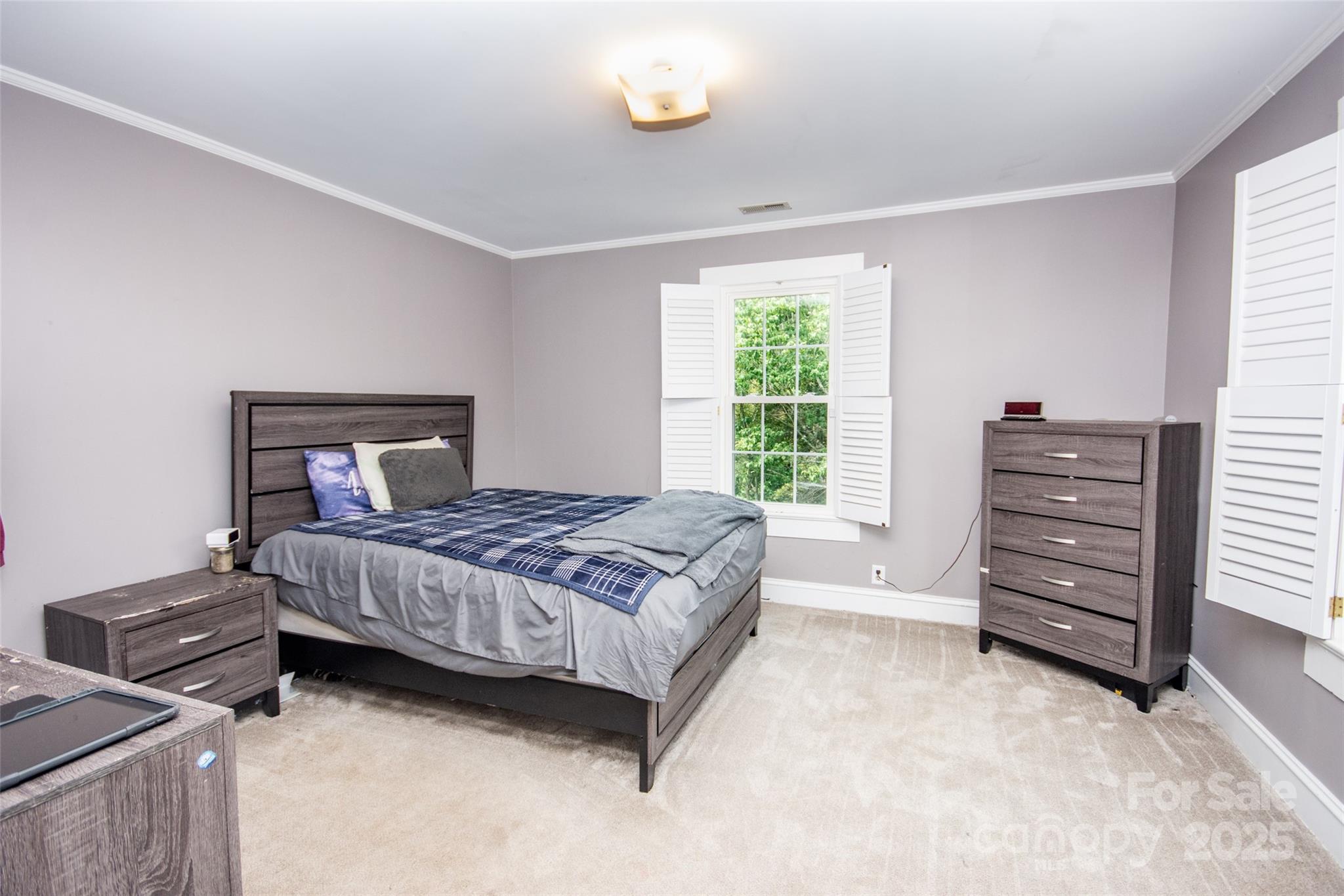 10245 Cool Springs Road Cleveland, NC 27013 - Photo 21 of 48 a bedroom with a bed and a dresser