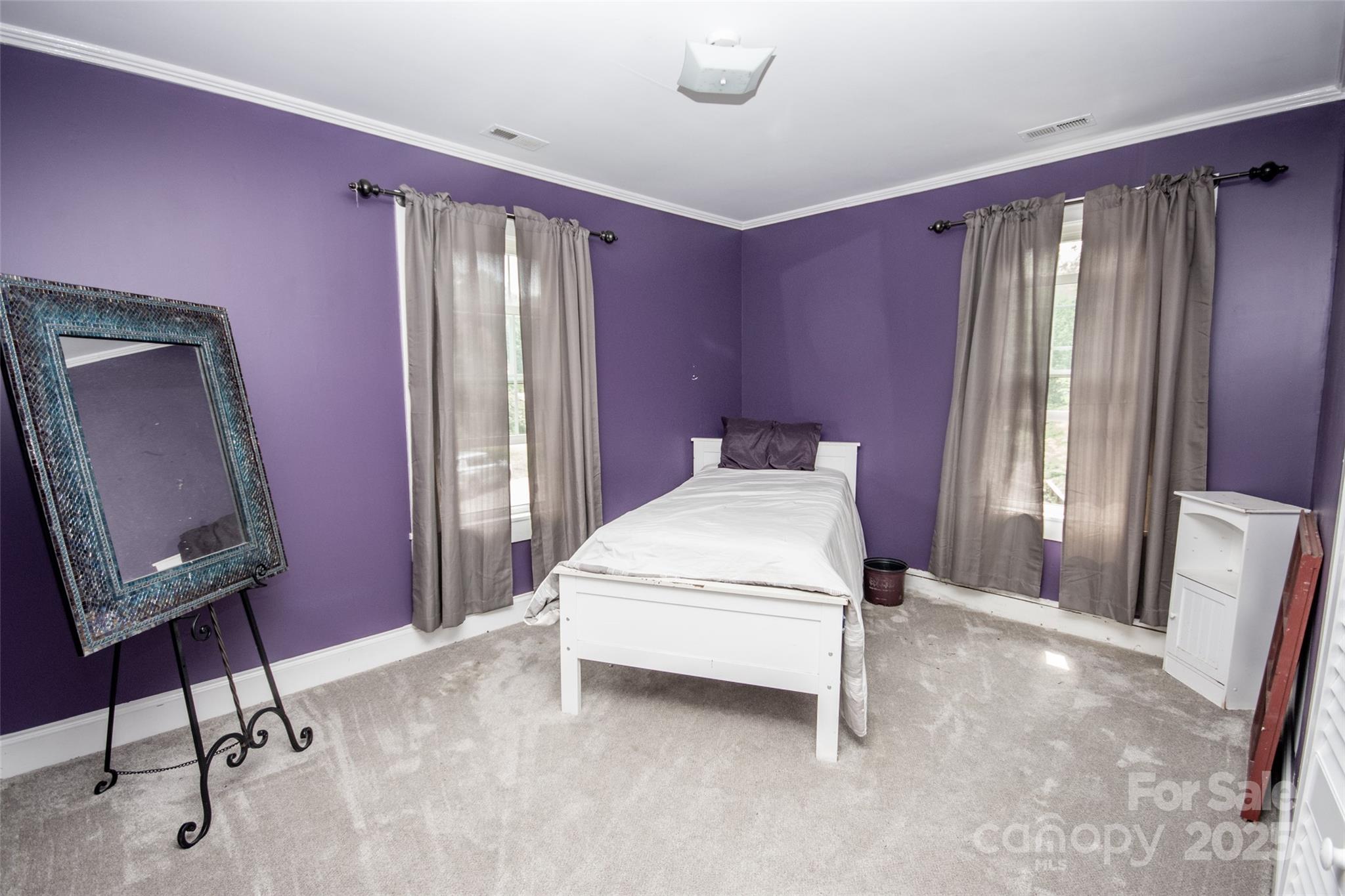 10245 Cool Springs Road Cleveland, NC 27013 - Photo 24 of 48 a bed room with a bed window and a mirror