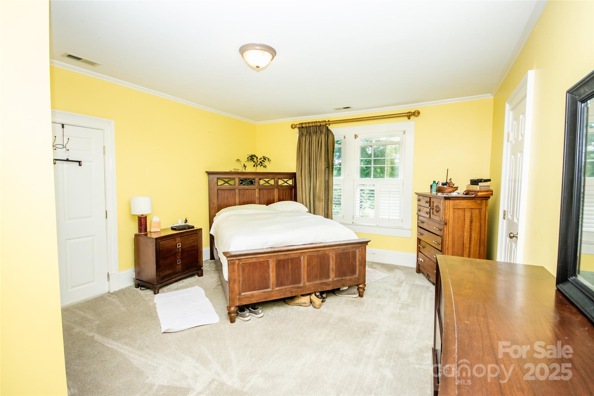 10245 Cool Springs Road Cleveland, NC 27013 - Photo 27 of 48 a spacious bedroom with a bed and wooden floor