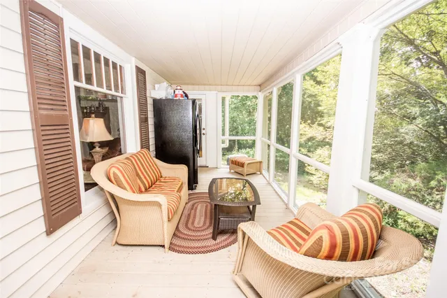 a lobby with furniture and floor to ceiling window
