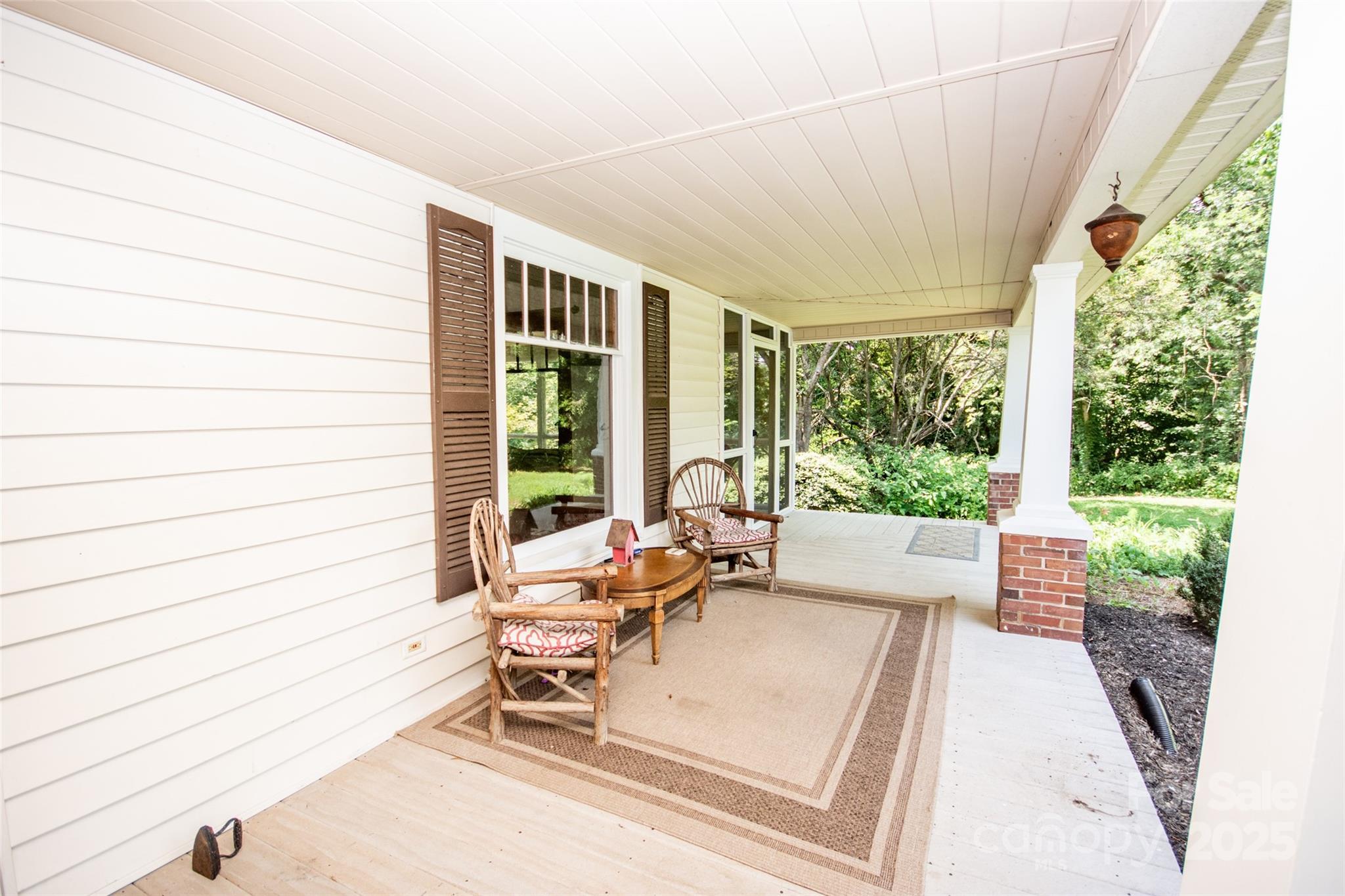 10245 Cool Springs Road Cleveland, NC 27013 - Photo 32 of 48 a outdoor space with patio the couches and a dining table with garden view