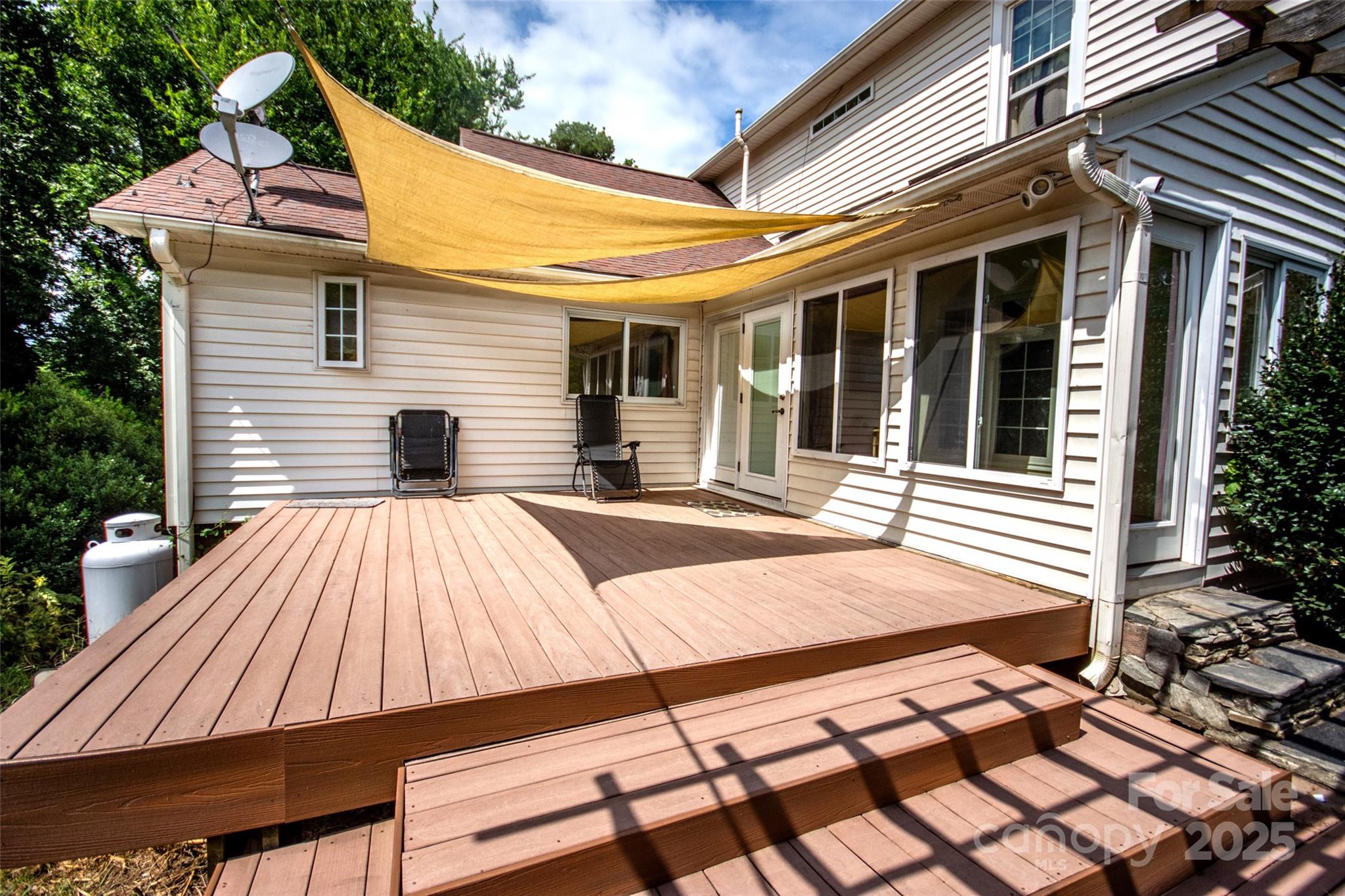 10245 Cool Springs Road Cleveland, NC 27013 - Photo 35 of 48 a view of a house with a barbeque and wooden stairs