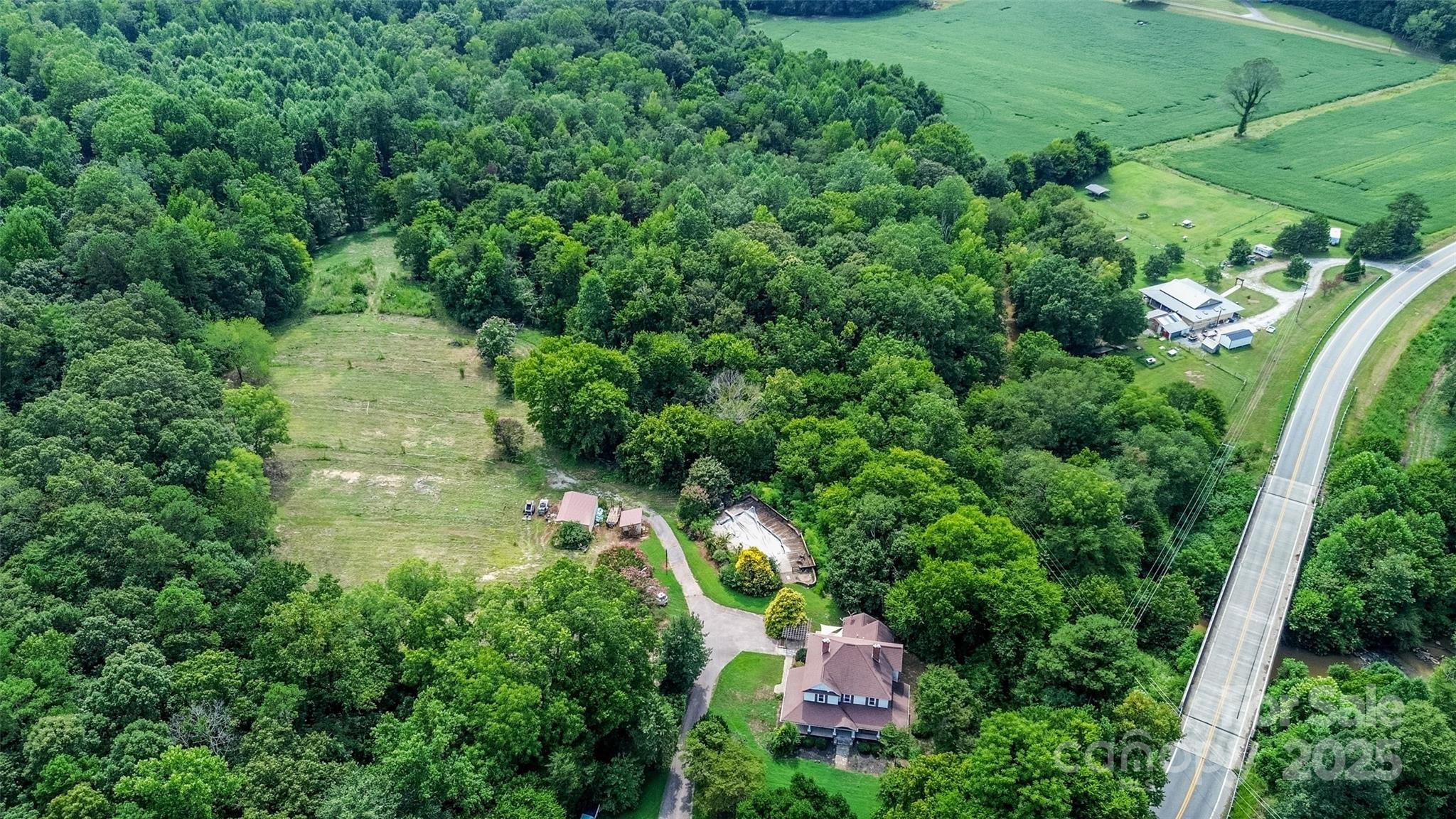 10245 Cool Springs Road Cleveland, NC 27013 - Photo 39 of 48 an aerial view of residential house with outdoor space and trees all around