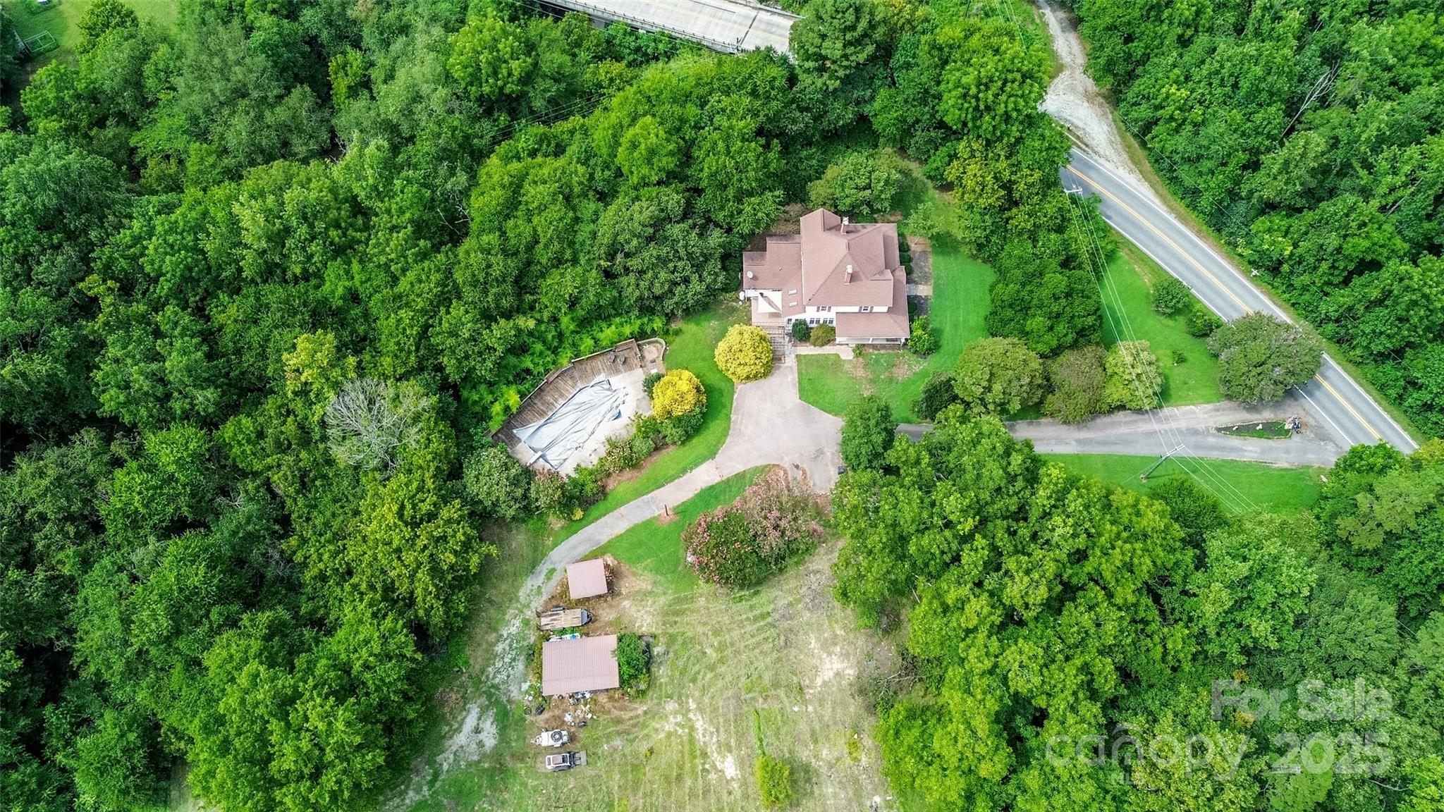 10245 Cool Springs Road Cleveland, NC 27013 - Photo 43 of 48 an aerial view of residential house with outdoor space and trees all around