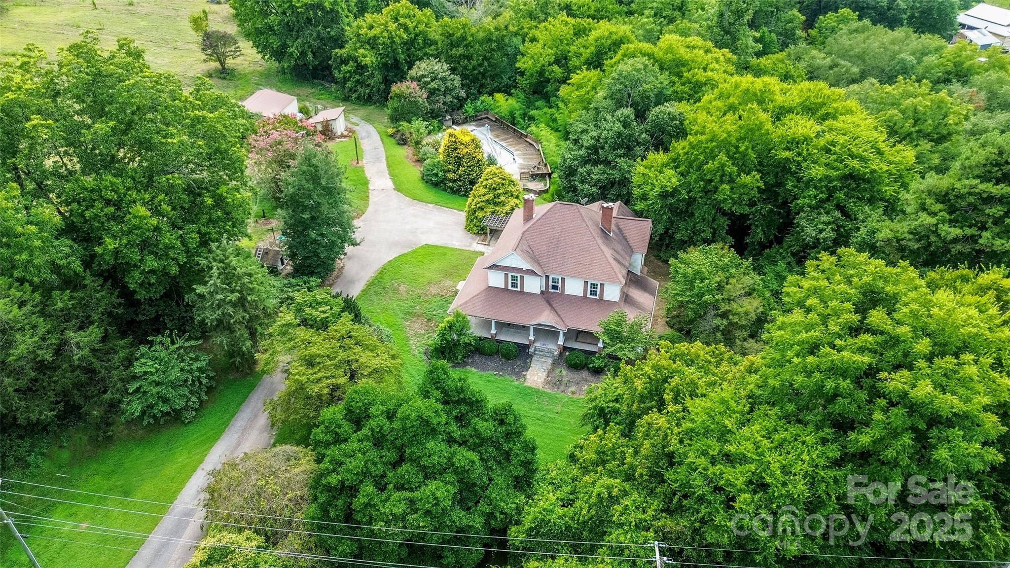 10245 Cool Springs Road Cleveland, NC 27013 - Photo 45 of 48 an aerial view of a house with a garden