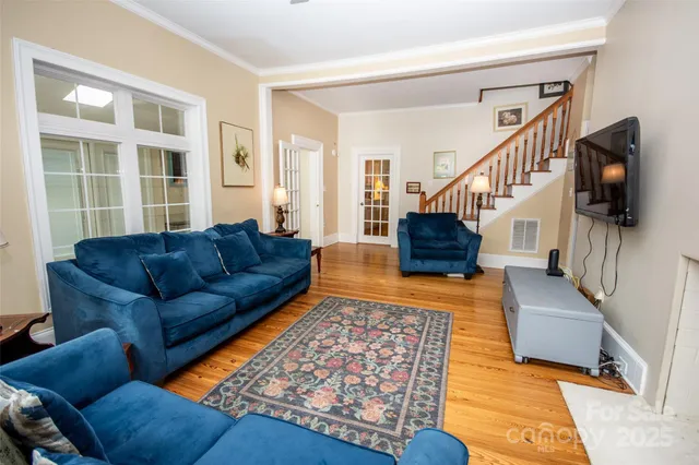 a living room with furniture and a rug