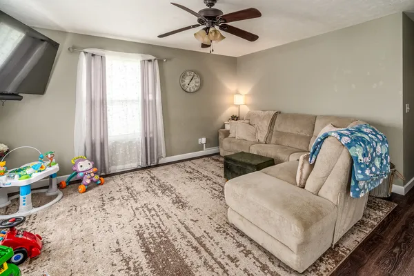 a bedroom with a bed and flat screen tv