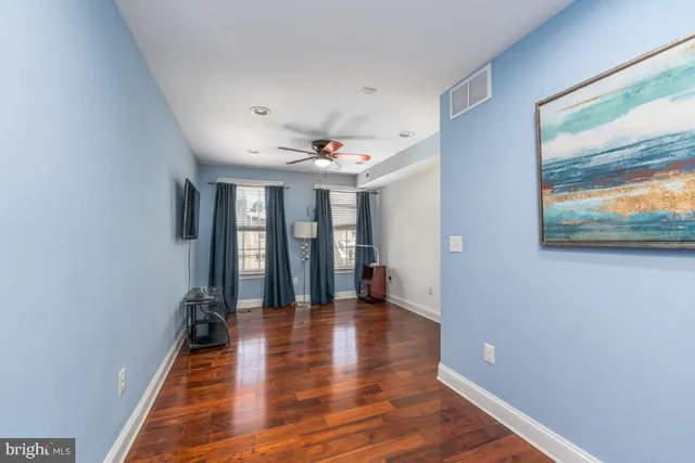 a view of an entryway with wooden floor