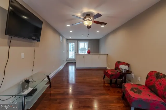 a view of a livingroom with furniture and wooden floor