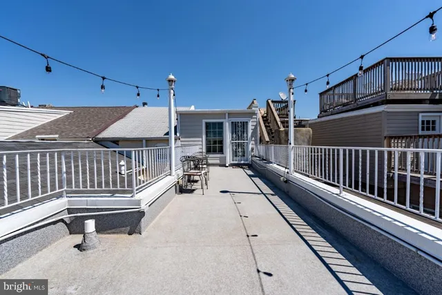 a view of a balcony with chairs