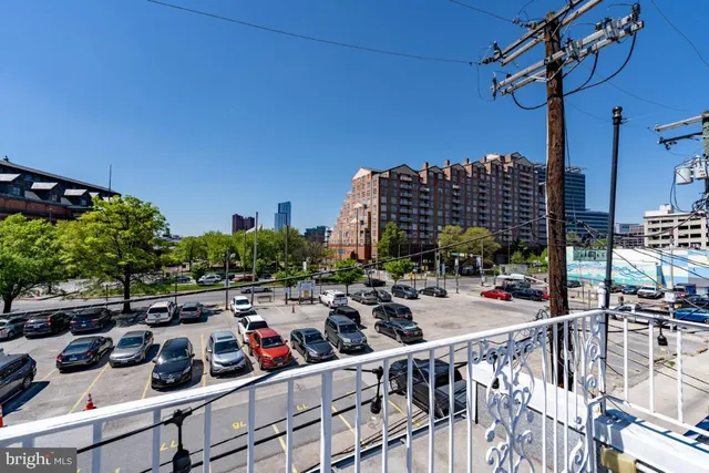 a view of a chairs and tables in the balcony