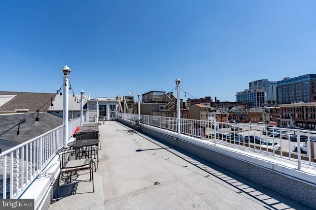 a view of a chairs and tables in the balcony