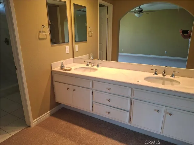 a bathroom with a sink and mirror