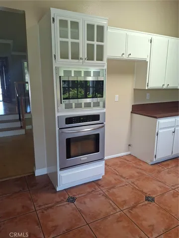a kitchen with a stove and a cabinet