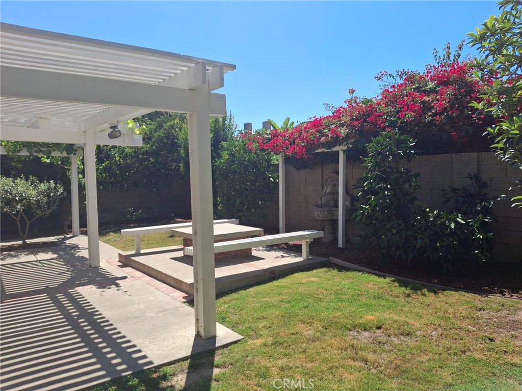 12 Hidalgo Irvine, CA 92620 - Photo 21 of 24 a view of a patio with a table and chairs and potted plants