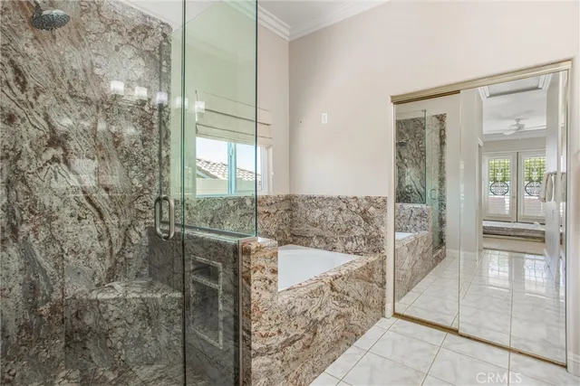 a bathroom with shower and bathtub