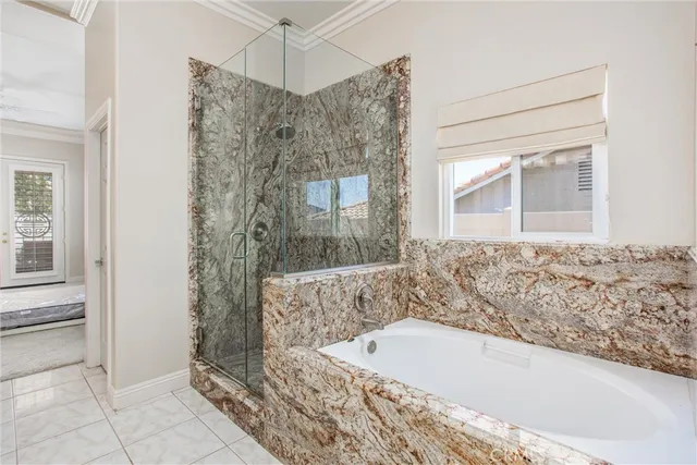 a bathroom with a bathtub and a shower