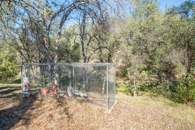an aerial view of a houses with a yard