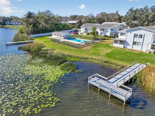a view of a swimming pool with lounge chair