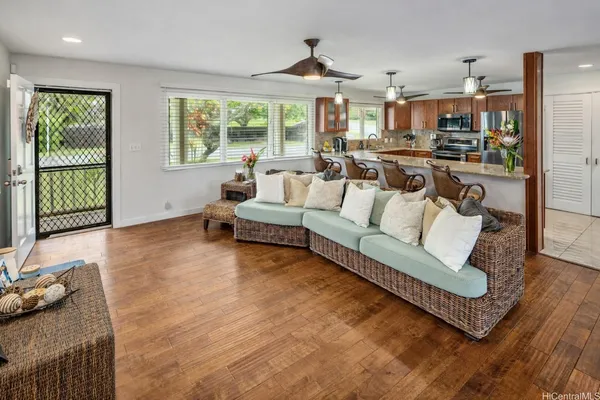 a living room with furniture and a large window