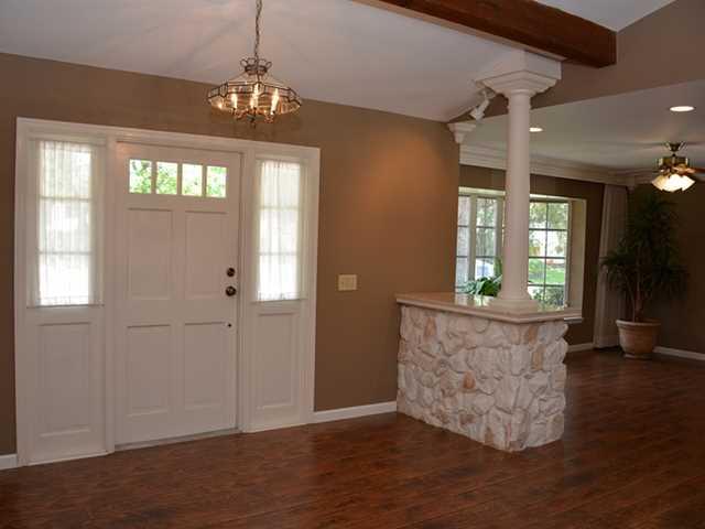 101 South River Road Stuart, FL 34996 - Photo 11 of 22 a view of an empty room with wooden floor and a window