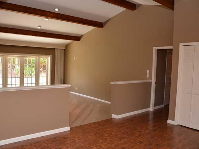 101 South River Road Stuart, FL 34996 - Photo 14 of 22 an empty room with wooden floor and windows