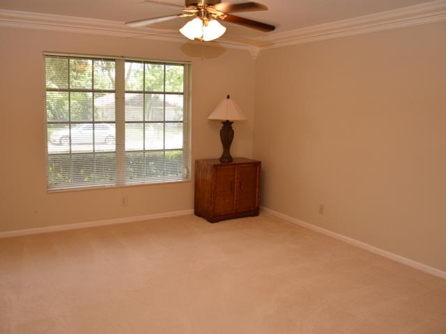 101 South River Road Stuart, FL 34996 - Photo 16 of 22 an empty room with windows and chandelier fan