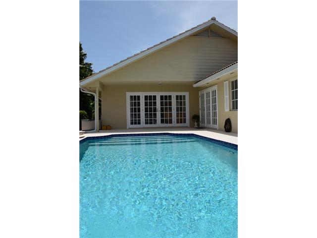 101 South River Road Stuart, FL 34996 - Photo 4 of 22 a view of a house with a backyard