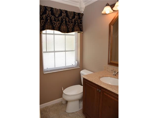 101 South River Road Stuart, FL 34996 - Photo 10 of 22 a bathroom with a sink and a toilet