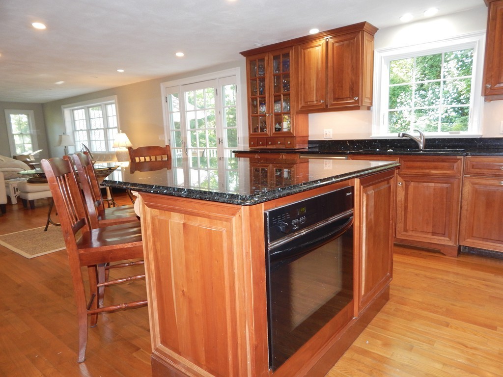 28 Stonehorse Road Barnstable, MA 02655 - Photo 14 of 23 a kitchen with stainless steel appliances granite countertop a stove a sink and a microwave