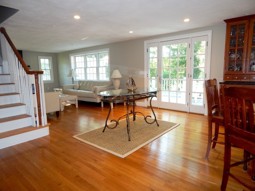 28 Stonehorse Road Barnstable, MA 02655 - Photo 16 of 23 a living room with fireplace furniture and a large window