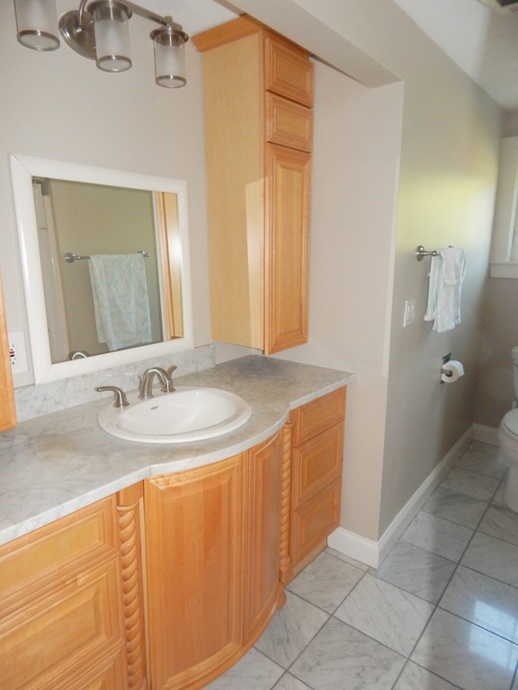 28 Stonehorse Road Barnstable, MA 02655 - Photo 19 of 23 a bathroom with a sink and a mirror