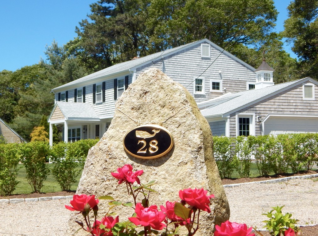 28 Stonehorse Road Barnstable, MA 02655 - Photo 6 of 23 a front view of a house with yard and sitting area