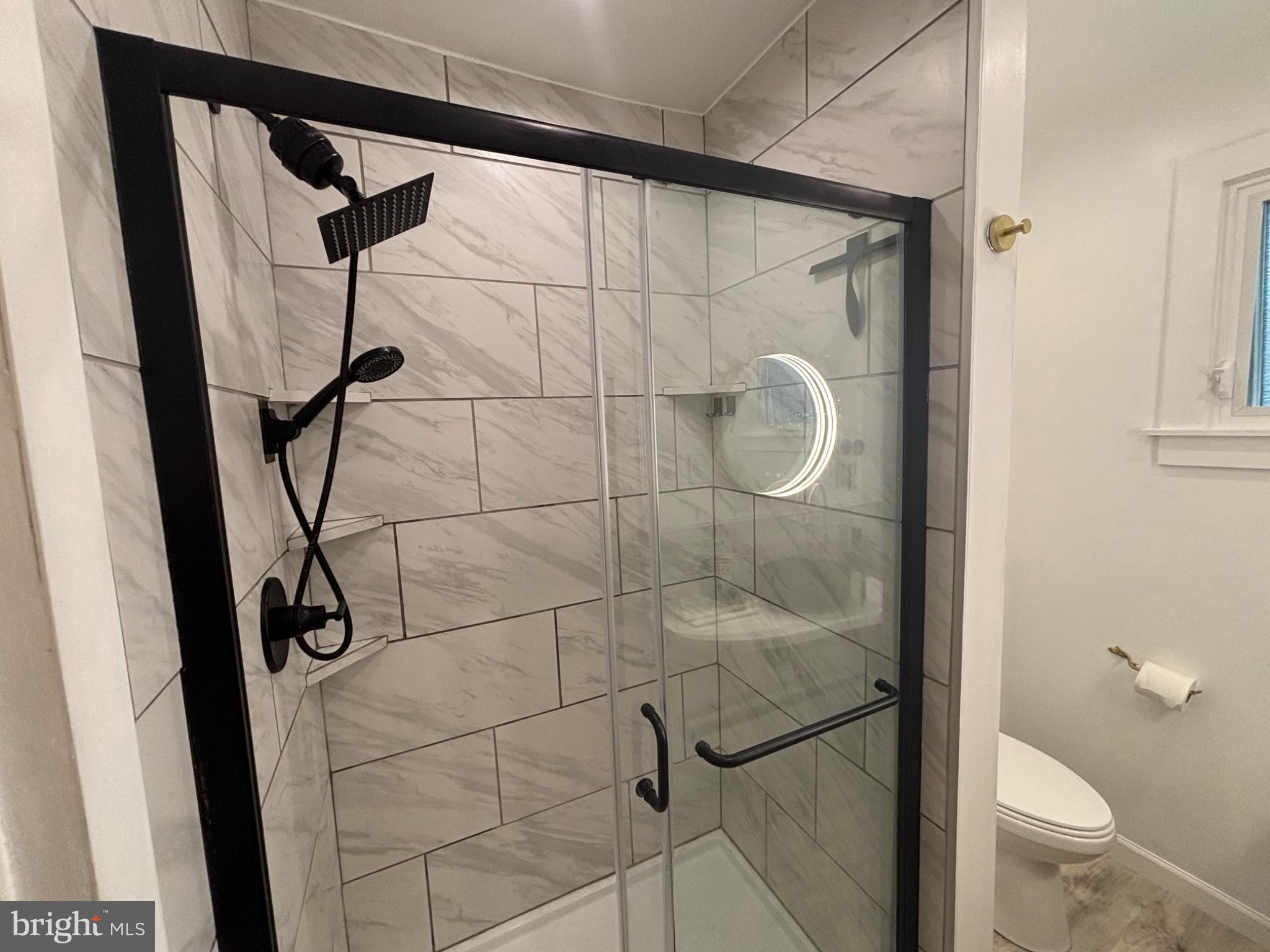 4101 Vernon Road Drexel Hill, PA 19026 - Photo 11 of 26 Sleek modern shower with elegant tiles.
