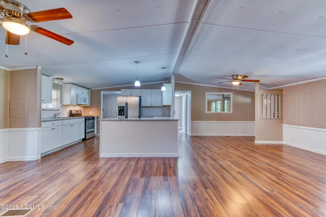 a view of a room with a large window